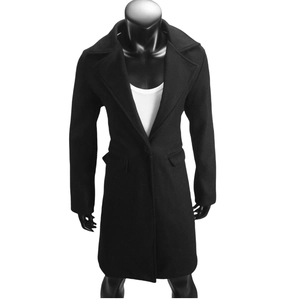 Detail view of women's black wool blend coat with single button lapel and flap pockets