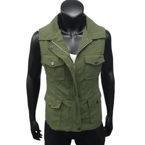 Detail of army green military style vest with four utility pockets and zipper closure