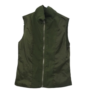 Detail view of military green stand collar vest with metal zipper and structural seams