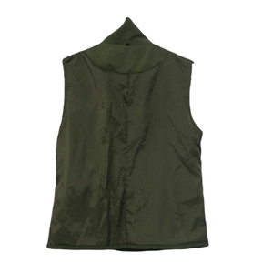 Detail view of olive green quilted vest interior showing high collar and smooth lining