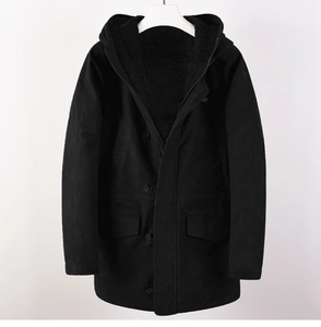 Close-up of black hooded parka featuring thick faux shearling lining and durable zipper detail