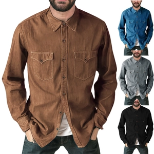 Detail view of men's long sleeve denim work shirts in multiple colors with chest pockets