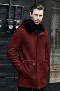 Detail of burgundy faux suede jacket with warm black lining and utilitarian cargo pockets