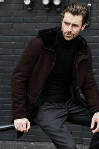 Detail of dark brown faux suede hooded jacket with warm black plush fleece lining and zipper
