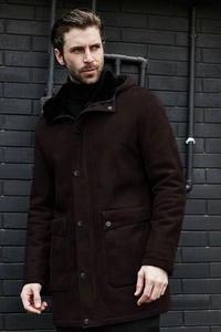 Detail of premium brown faux suede parka featuring thick black faux fur lining and hood