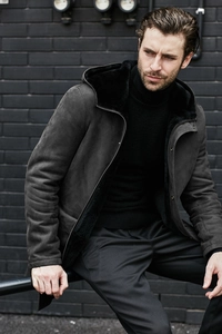 Detail of faux fur lining and suede texture on dark grey hooded winter jacket for men