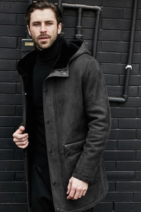 Detail of men's charcoal suede coat with faux fur lining and multiple snap buttons