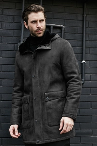 Detailed view of the thick faux shearling lining and suede texture of the hooded coat