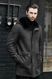 Detailed view of the dark grey faux suede texture and thick faux fur lining on hooded coat