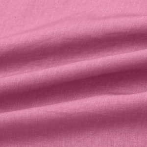 Macro detail of high-density mauve pink woven fabric showing plain weave texture