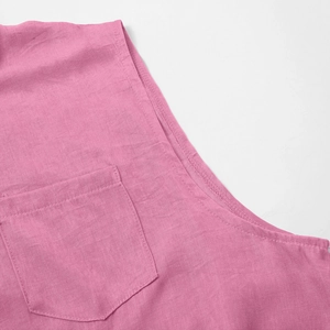 Detail showing high-quality linen texture on sleeveless shirt with chest pocket