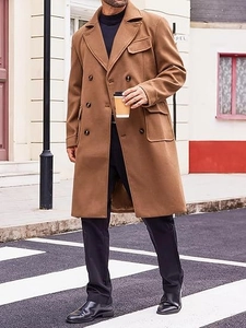 Macro detail of camel double-breasted wool coat showing pocket texture and classic wide lapels
