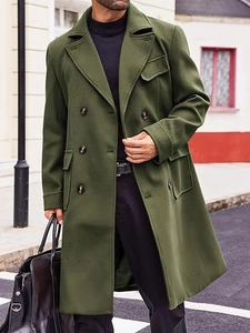 Detailed view of the double-breasted military green wool coat for men in city setting
