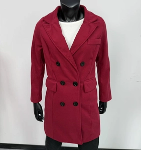 Macro shot of burgundy wool coat showing notched lapels and double-breasted buttons