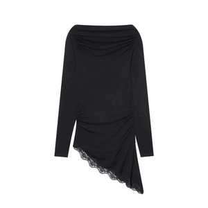 Detail of elegant off-shoulder black top with ruched texture and irregular lace hem