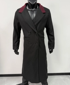 Detail of men's long double-breasted wool coat with contrasting burgundy lapel collar