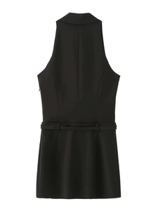 Detail of black sleeveless blazer dress featuring notched lapels and matching slim belt