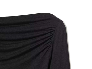 Detail of ruched shoulder design on black elegant off-shoulder top for women
