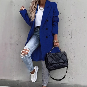 Classic double-breasted long wool blend coat in vibrant royal blue with peak lapels