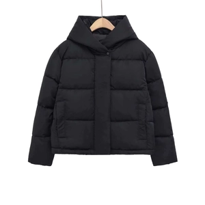 Women's black hooded puffer jacket with quilted padding and warm minimalist design