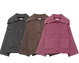 Close-up of knit cardigans with checkered patterns in black, brown and magenta colors