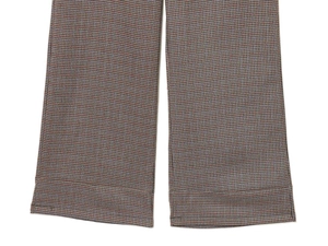 Close-up of retro houndstooth pattern fabric with neat stitching on the trouser hem