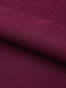 Detailed close-up of burgundy knit fabric texture on this sleeveless summer dress