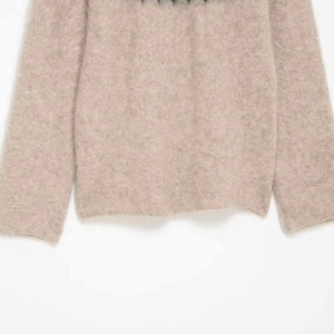 Oatmeal textured knit sweater made of fuzzy mohair wool blend with a loose relaxed fit