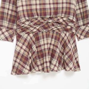 Stylish plaid mini dress with cross-knot waist design and flared hem in brown tones