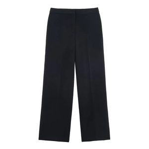 Detail view of high-waisted black wide-leg trousers with elegant drape and clean cut