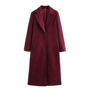 Detail view of burgundy long wool coat featuring a wide lapel and single button closure