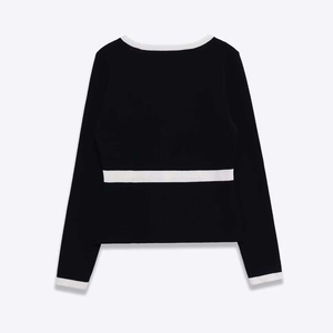 Women's chic black and white knit cardigan with contrast trim and slim fit design