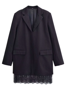 Detail view of the black blazer dress featuring delicate eyelash lace trim at the hemline