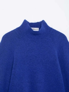 Detailed view of royal blue mock neck knit sweater with soft mohair texture
