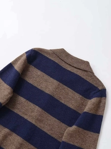 Detail of the knit collar and striped pattern on this navy and brown sweater