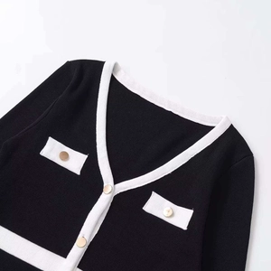 Classic black and white knit cardigan with V-neck and golden buttons for women