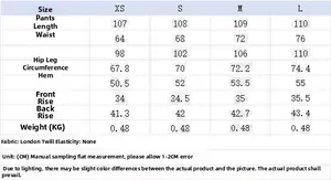 Size guide for black asymmetric wide leg trousers with detailed measurements in centimeters