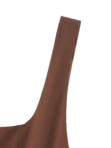 Detail of caramel brown strap showing matte fabric texture and precise stitching lines