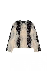 Close-up of black and white striped faux fur texture on a cropped autumn jacket
