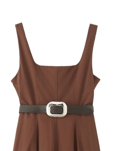 Detail of square neck brown A-line dress with black belt and silver metal buckle