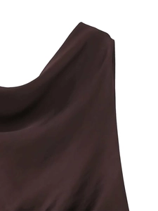 Detail view of smooth chocolate brown satin fabric with elegant draped cowl neckline design