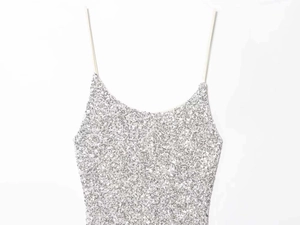 Close-up of shimmering silver sequin camisole dress with delicate spaghetti straps