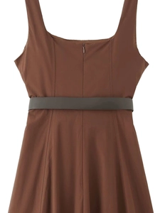 Detail of caramel brown A-line dress featuring a dark waist belt and invisible back zipper