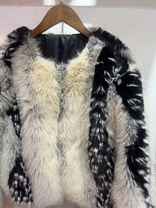 Close-up of multicolor faux fur jacket showing high-quality texture and paneling detail