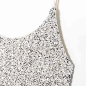 Silver sequin camisole dress for women featuring delicate straps and metallic glitter finish