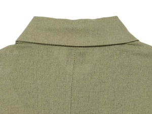 Macro shot of olive green linen blazer collar showing natural fiber texture and stitching