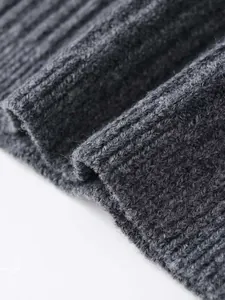 Macro shot of dark grey ribbed knit fabric showing detailed vertical texture and soft fiber