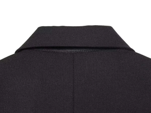Detail of the high-quality black twill fabric and refined stitching on the back collar