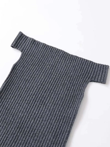 Macro detail of grey off-shoulder ribbed knit fabric with folded neckline texture