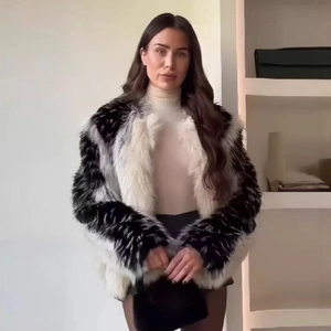 Faux fur jacket with black and white color block design and plush luxury texture